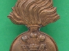 KK 693. Royal Irish Fusiliers, All brass economy 1916 badge. Slide18x38 mm.