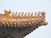 Taget på Kejserens palads i Den Forbudte By med kejsernes symbol fabeldyret der er sammensat af en løve, en hjort og en fisk, med 10 stk som er det højeste.