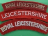 Royal Leicestershire Regiment cloth shoulder titles.