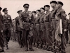 King Frederik IX inspecting as Colonel-in-Chief the honour Guard of the Royal East Kent Regiment (The Buffs) when they get new colours, 9th May 1955