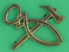Cox-page-245.-Armourer-arm-badge.-Four-lugs-42x31-mm.