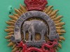 Cap badge, 1st Punjab Regiment, 1922-1947 Bi-metal badge with an elephant above a cartouche bearing the battle honour, 'Assaye', above a Chinese dragon, surmounted by a curved scroll bearing the unit title, '1st Punjab Regiment'-36-x-43mm-1