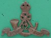 Cap badge, 12th Frontier Force Regiment, 1922-1945 White metal badge, with King's Crown over a bugle horn, with regimental number, '12' within its knotted cord, with scroll bearing the unit title, 'F.F. Regt'.-55-x-40mm-1